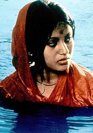 Film still from Distant Thunder (1973). Image of a woman in the water.