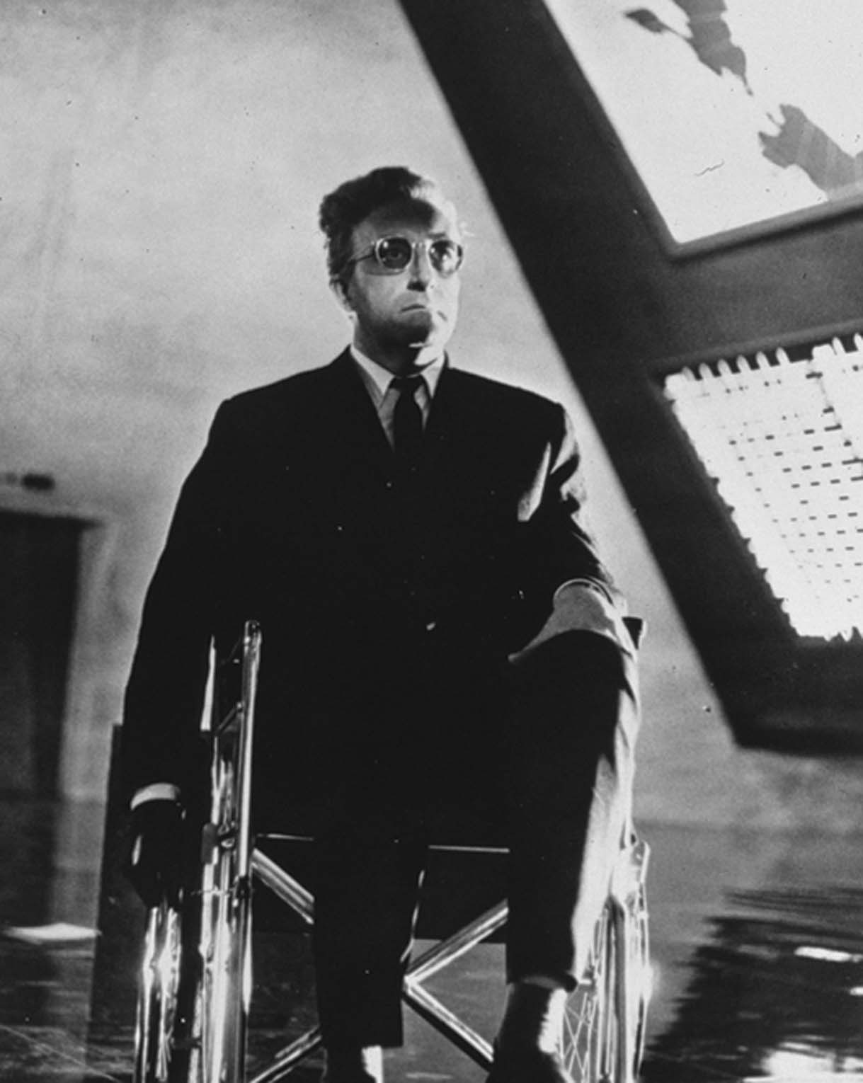 Film still from Dr. Strangelove Or How I Learned to Stop Worrying About the Bomb (1964). Image of a man in a wheelchair.