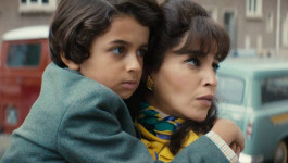 Film still from Once Upon My Mother (2025). Image of a mother holding her son.